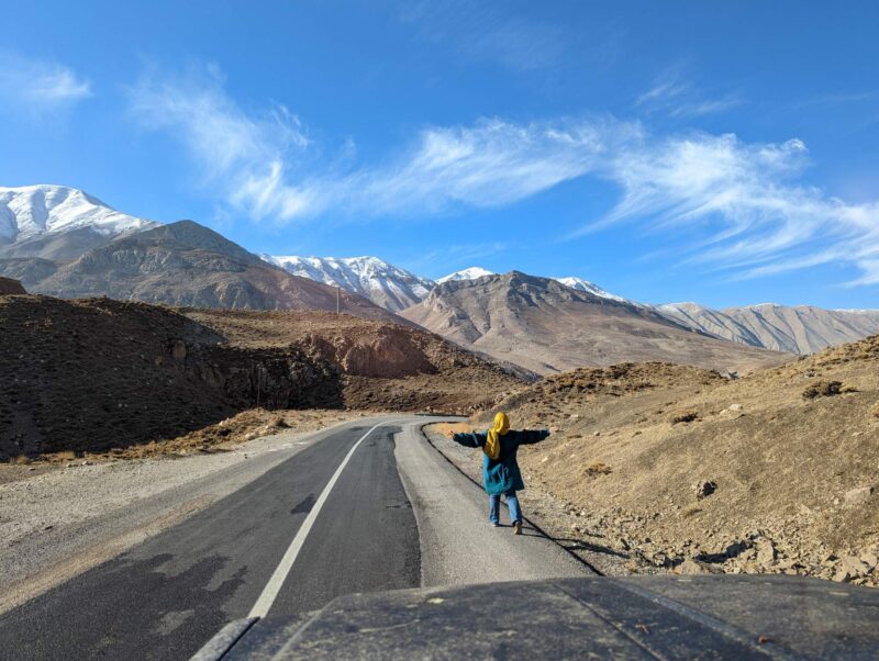 Saeideh Ajilchi running out of pure joy after seeing Mt. Damāvand in the Dashte Gole-Zard area, two hours northeast of Tehran, Iran. Copyright Ali Torkzadeh, EscapefromTehran.com